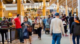 shoppers in mall shopping consumers
